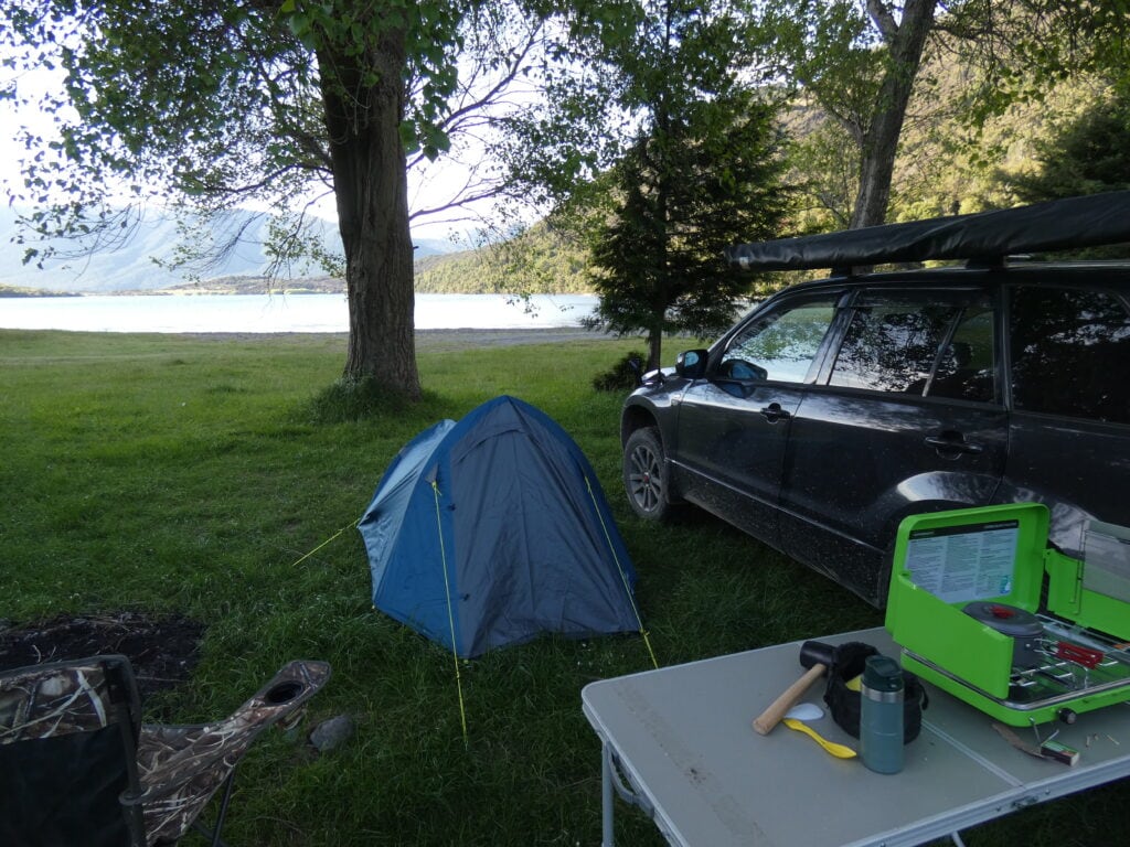 The campsite set up with the table, cooker and tent infront of there with my Escudo to the side with Loch Katrine in the distance