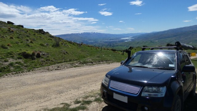Looking north back towards the river. The Suzuki Escudo looking north back at the River with a touh of snow on the hills.