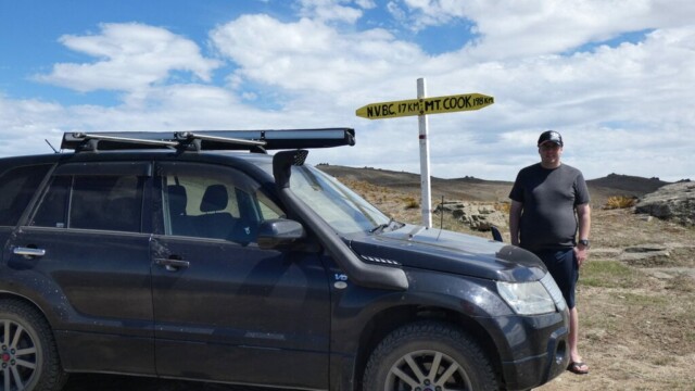 Got to have at least one photo of me. Me standing with teh road sign pointing towards NVBC and Mt Cook