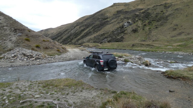 Driving back over a River Crossing to get some photos coming back Driving back over a River Crossing to get some photos coming back. With the river flowing betwen the hills