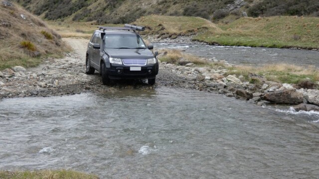 Getting ready to cross the river. Lining up the Suzuki Escuso getting ready for the river crossing, with another river in the background bewteen the hills.