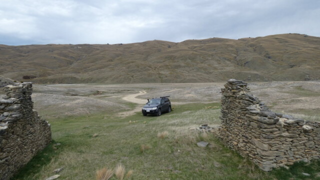 The Suzuki Escudo sitting outside an old gold miner's house The Suzuki Escudo sitting outside an old gold miners house