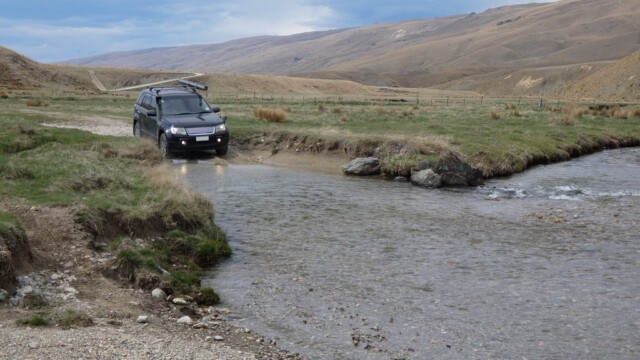 The Suzuki ready to dive into a water crossing. The Suzuki getting ready to drop into the water crossing